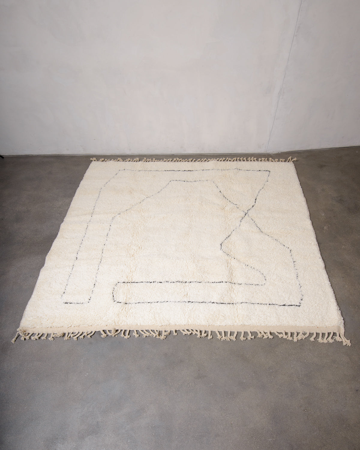 Modern, designer, handcrafted Berber rug from Morocco. Beniourain carpet with minimalist design, natural wool pile and a fluffy texture.